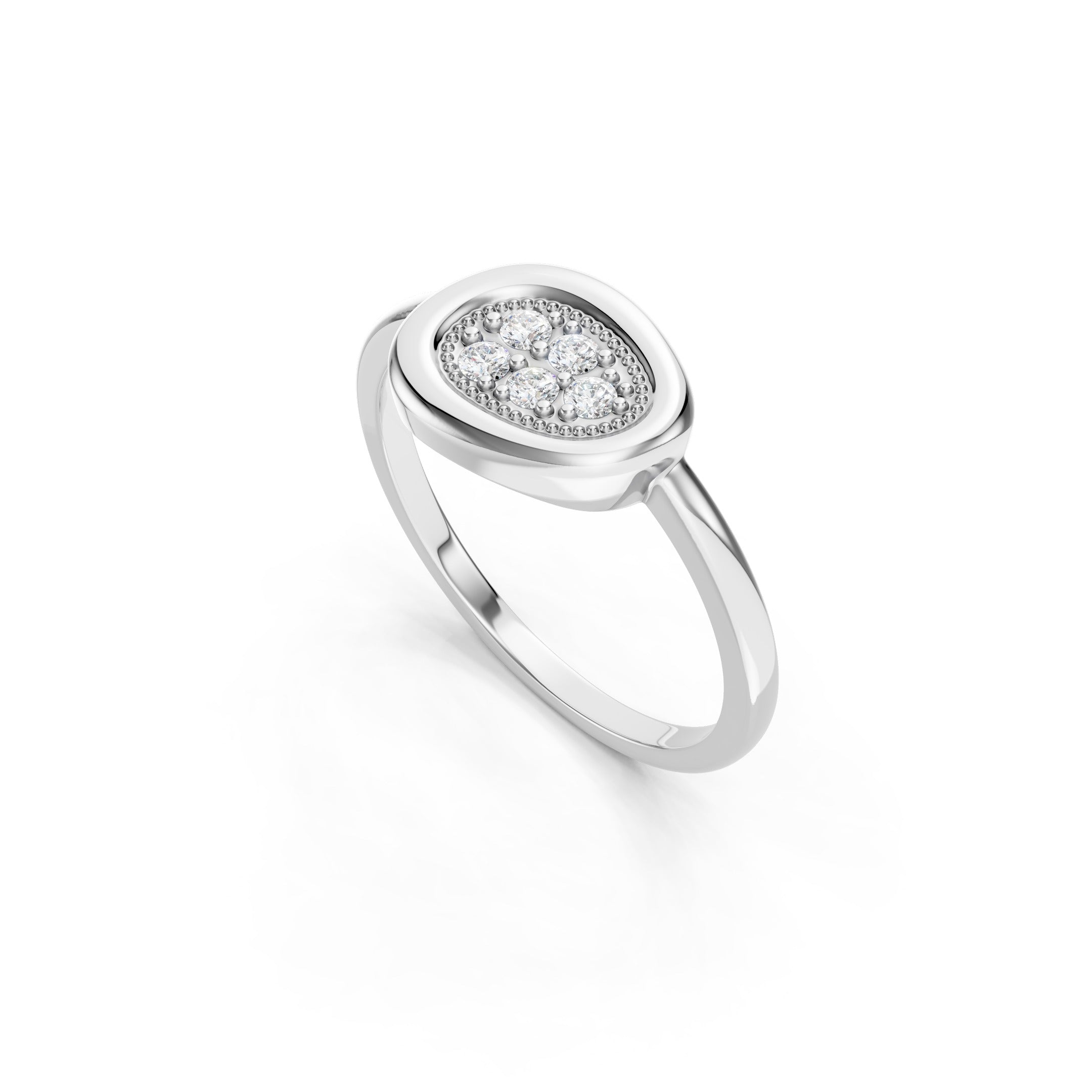 White gold oval cluster diamond ring featuring five round-cut diamonds in a decorative beaded bezel setting with a polished solid gold band.