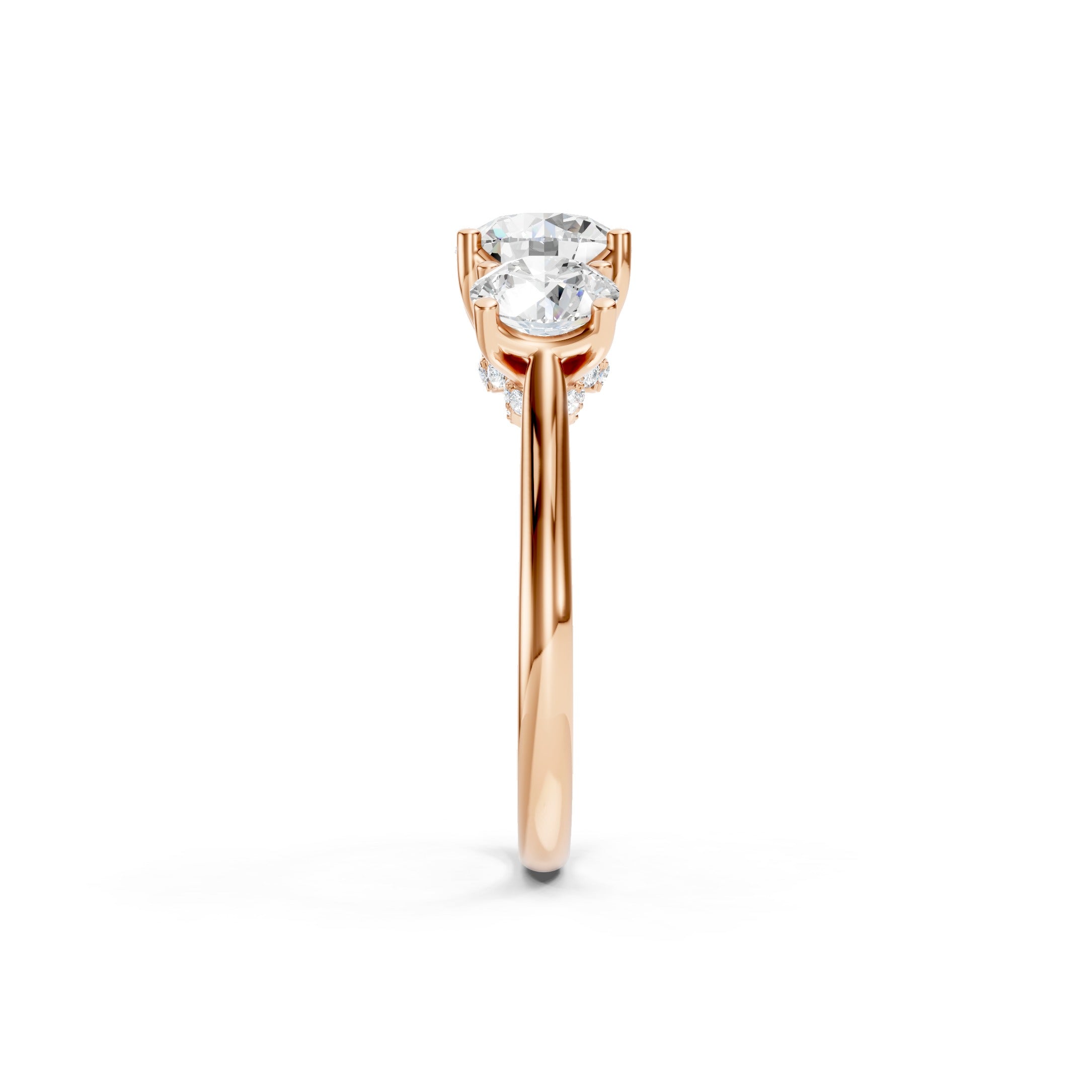 Rose gold three stone lab grown diamond engagement ring featuring a brilliant round cut center diamond, two matching round side diamonds, and an elegant prong setting.