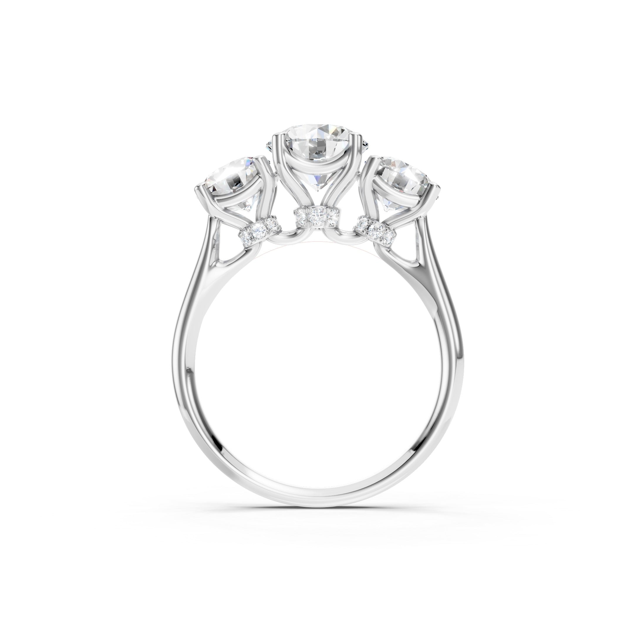 White gold three stone lab grown diamond engagement ring featuring a round cut center diamond, two matching round side diamonds, and a classic prong setting.