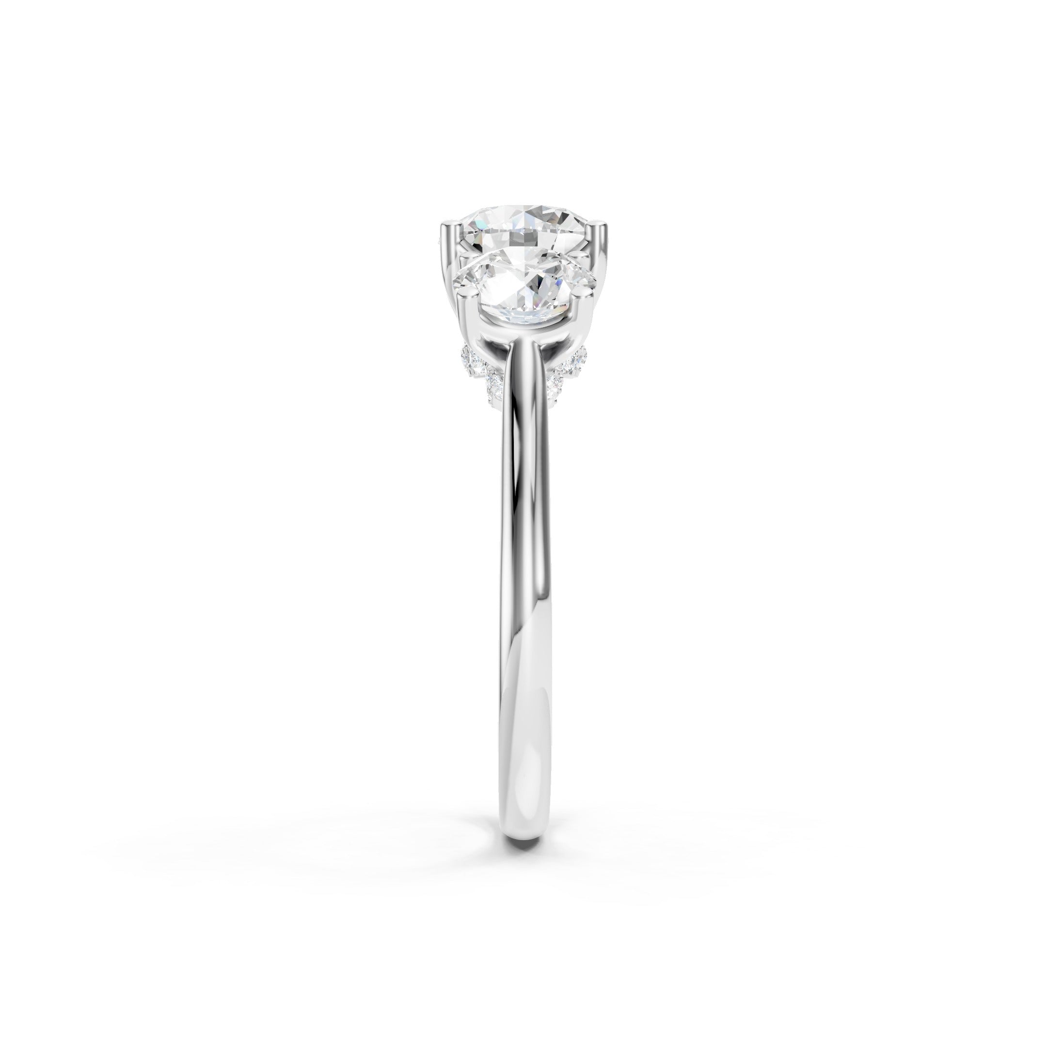 White gold three stone lab grown diamond engagement ring featuring a round cut center diamond, two matching round side diamonds, and a classic prong setting.
