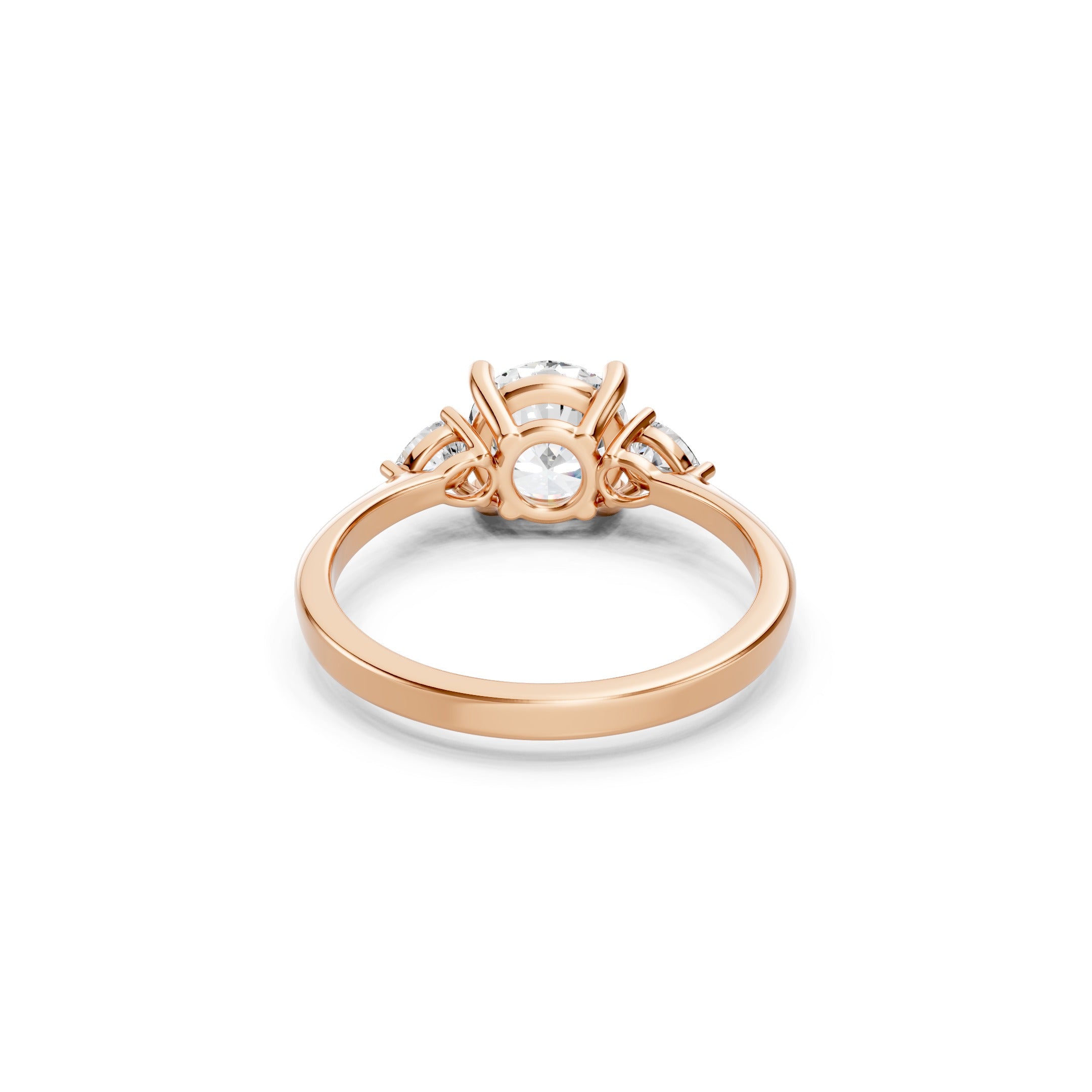 rose gold three stone lab grown diamond engagement ring showcasing the open gallery, secure prong settings, round center diamond, pear cut side stones, and polished band.