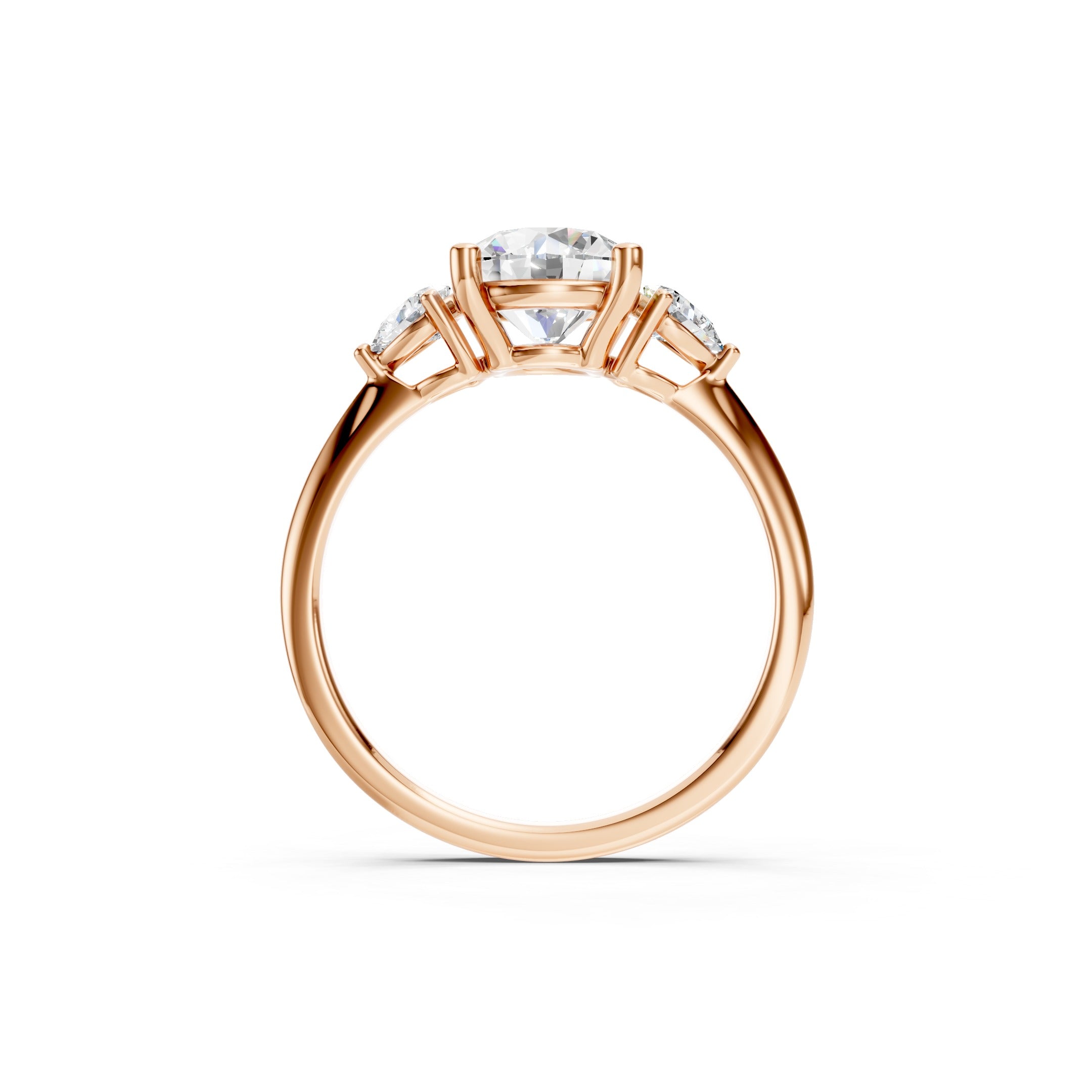 Rose gold three stone lab grown diamond engagement ring featuring a brilliant round center diamond and two pear cut side diamonds in a prong setting, luxury bridal ring for women.