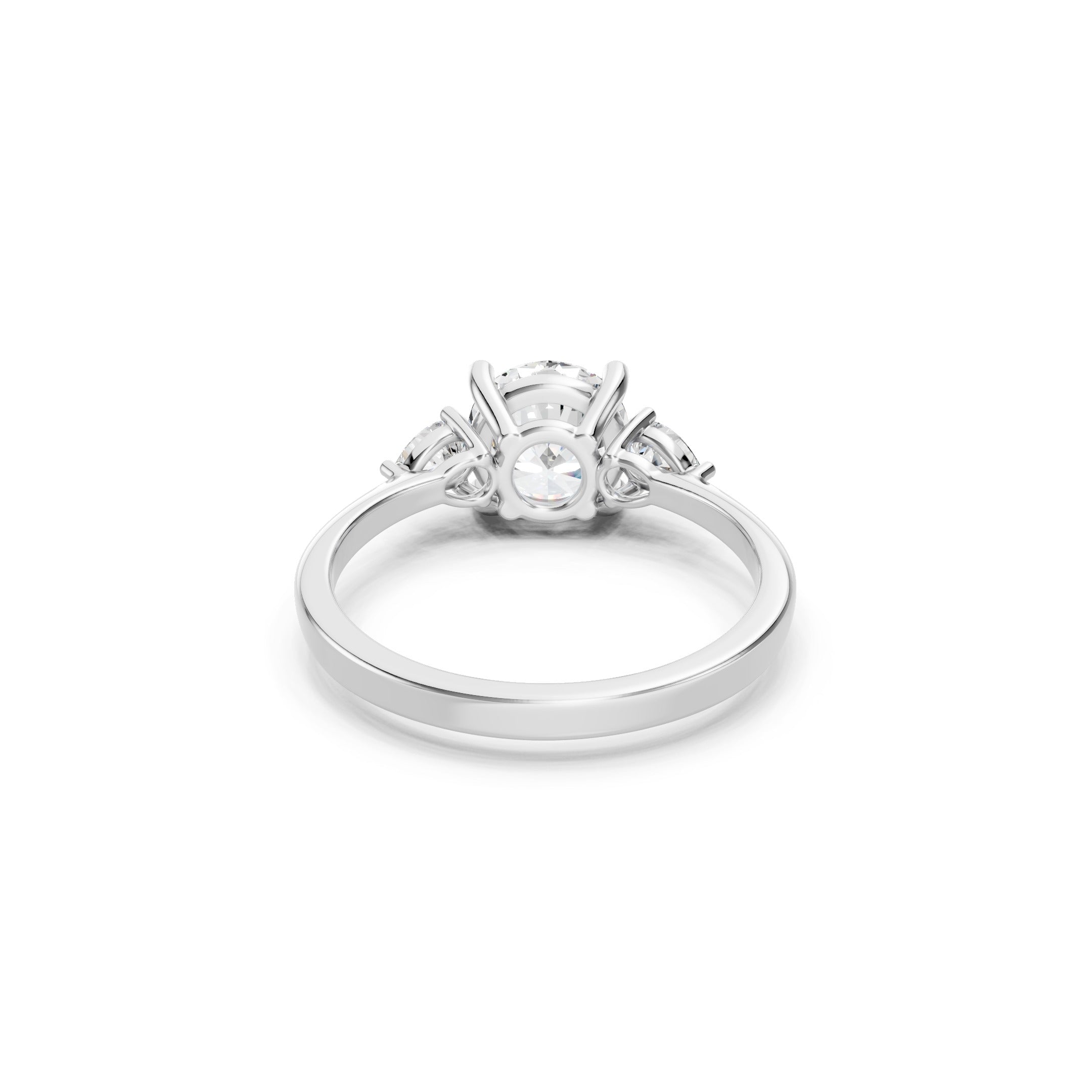 white gold three stone lab grown diamond ring showcasing the open gallery setting, secure prongs, round and pear cut diamonds, and a smooth polished band