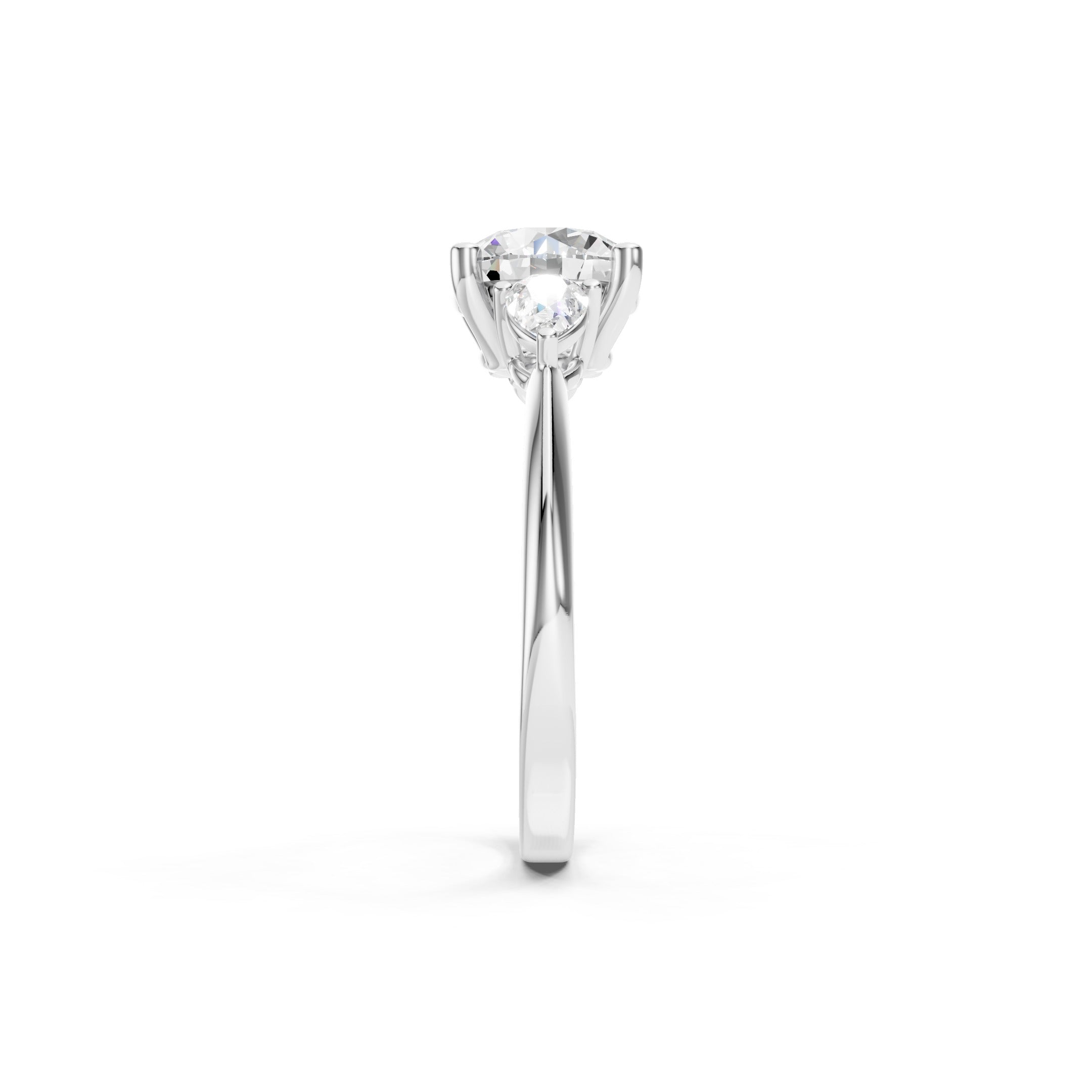 White gold three stone lab grown diamond engagement ring featuring a brilliant round center diamond and two pear cut side diamonds in a prong setting, elegant luxury bridal jewelry.