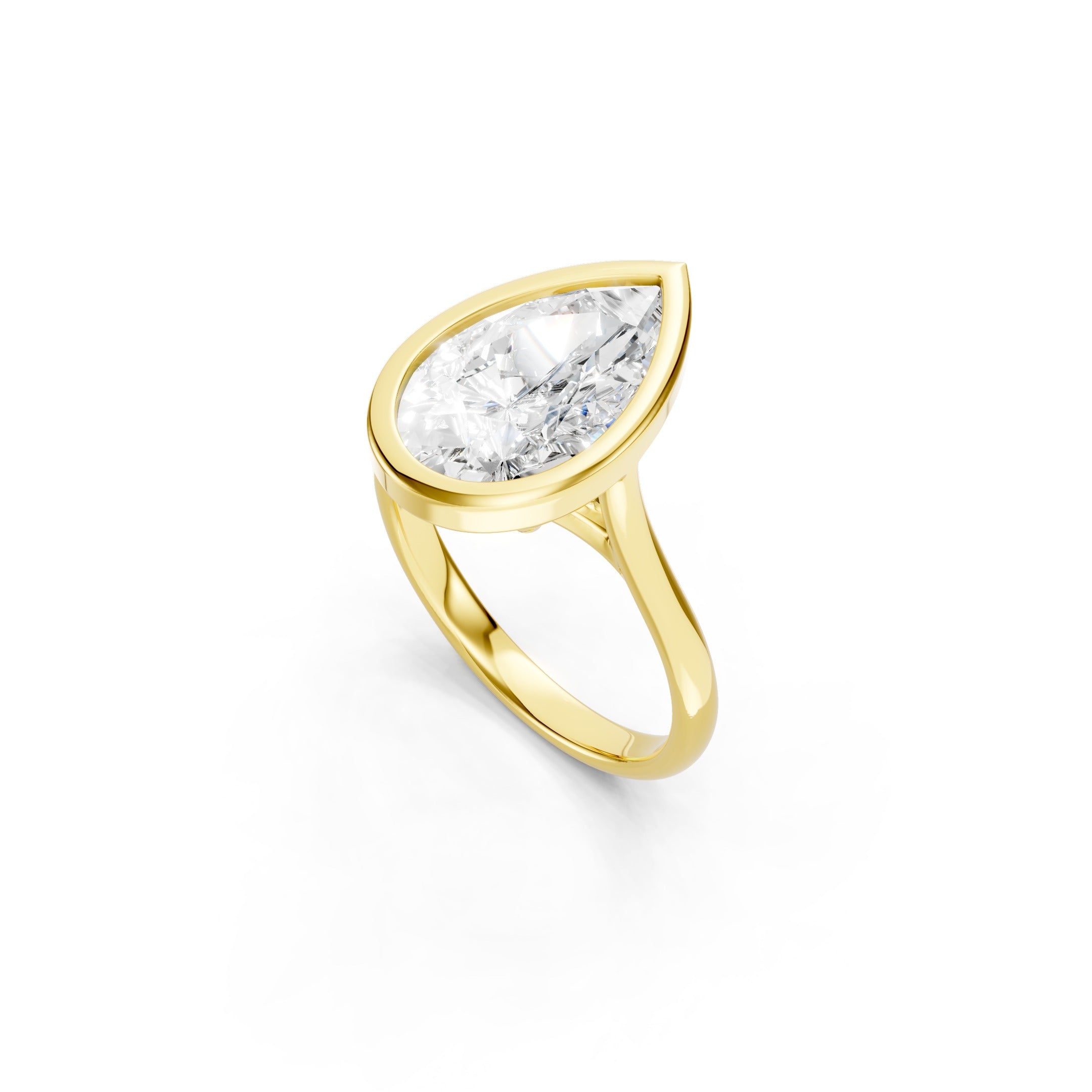 Pear Shaped Lab Grown Diamond Ring in Solid Yellow Gold, Modern Bezel Setting with a Minimalist Solitaire Design.