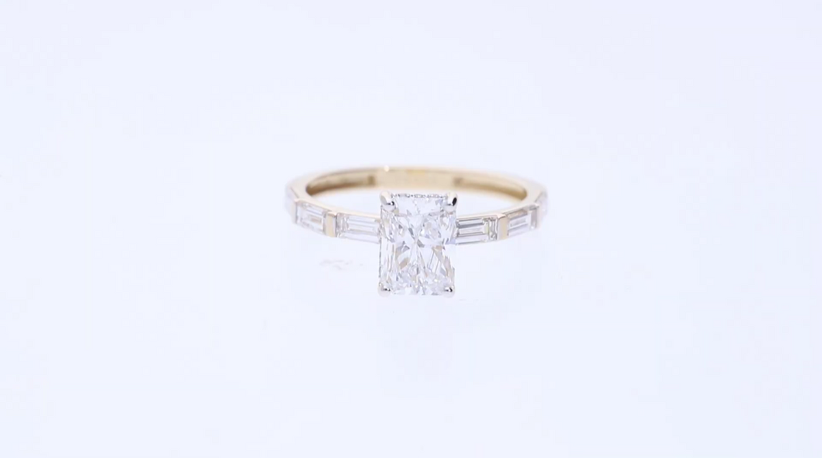 14kt Yellow Gold with Radiant centre with Baguette and Round lab grown daimond held in a four-prong "hidden halo" Engagement Ring